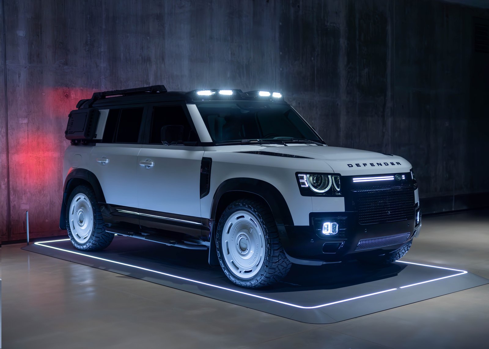 An Artemis-built Land Rover Defender on a lit studio plinth